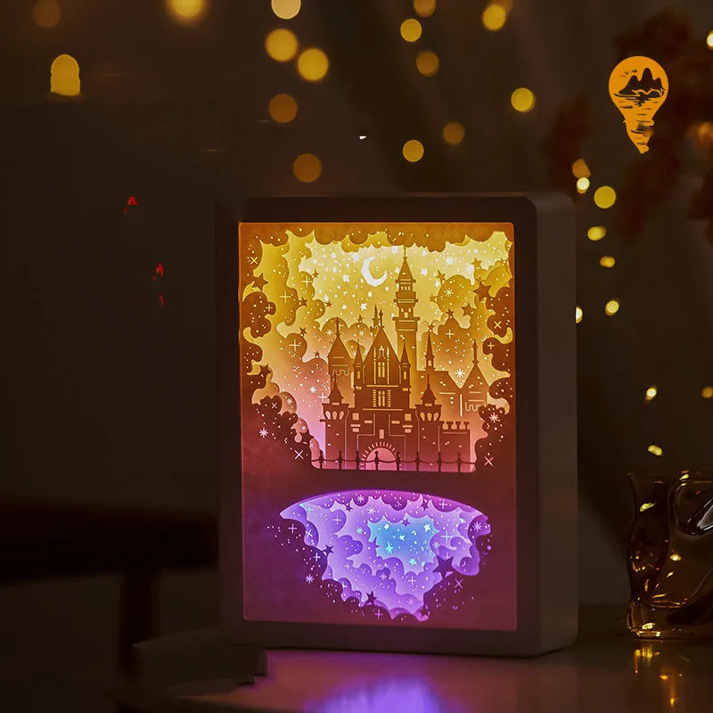 ABS frame bedside night light with 3D paper carving design and remote control on a table.