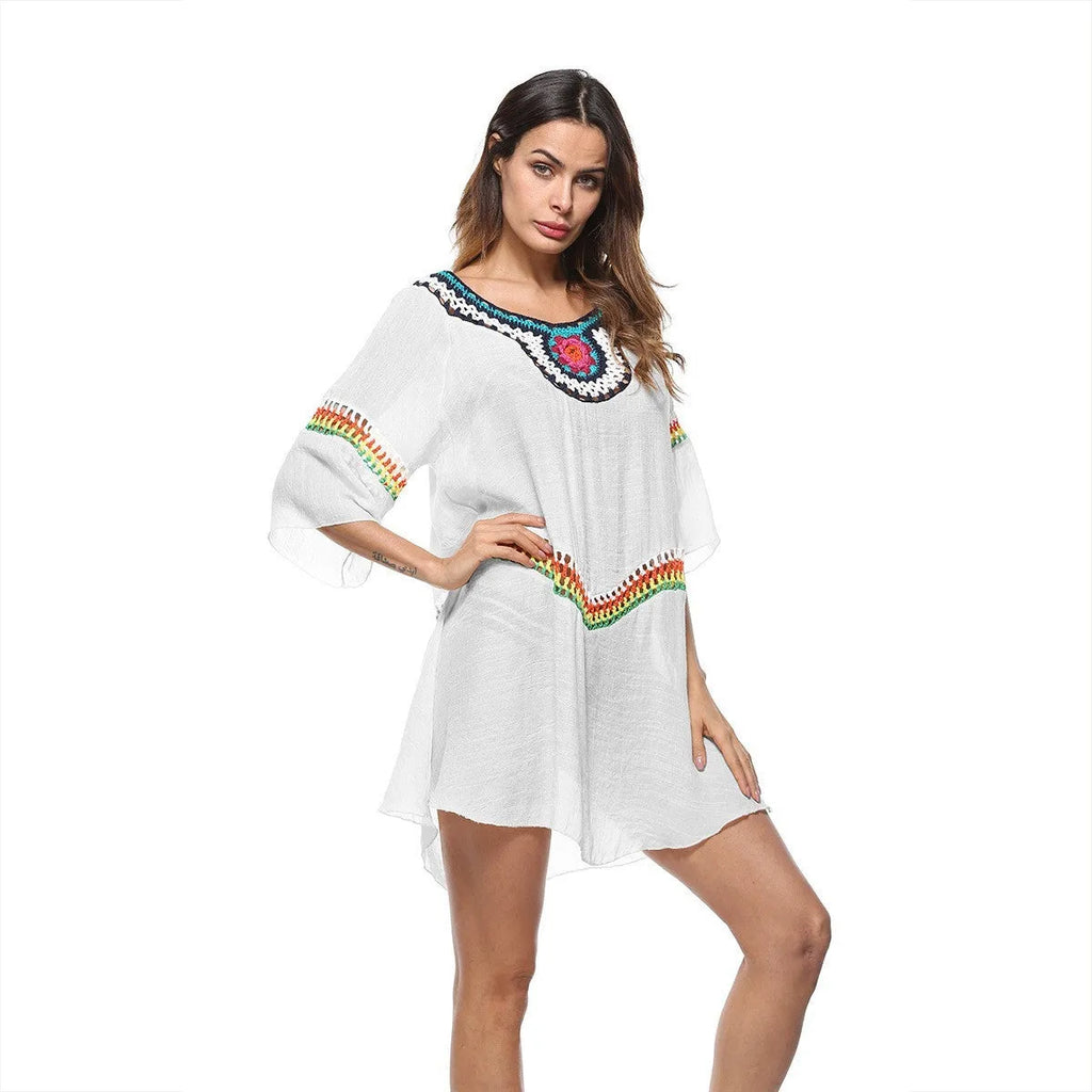 Women's crocheted ethnic style beach cover-up for sun protection, shown in apricot colour
