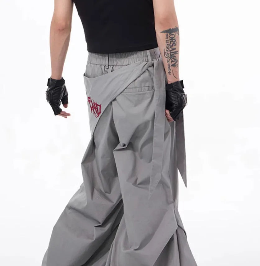Boy modelling black wide-leg summer trousers with a relaxed fit and Korean-inspired style.