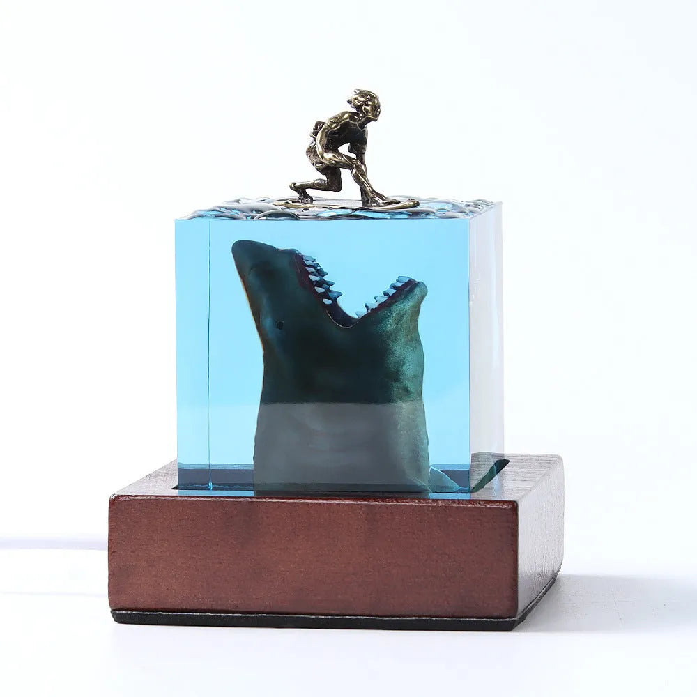 Clear epoxy resin ornament showing shark surfing on wave with integrated night light