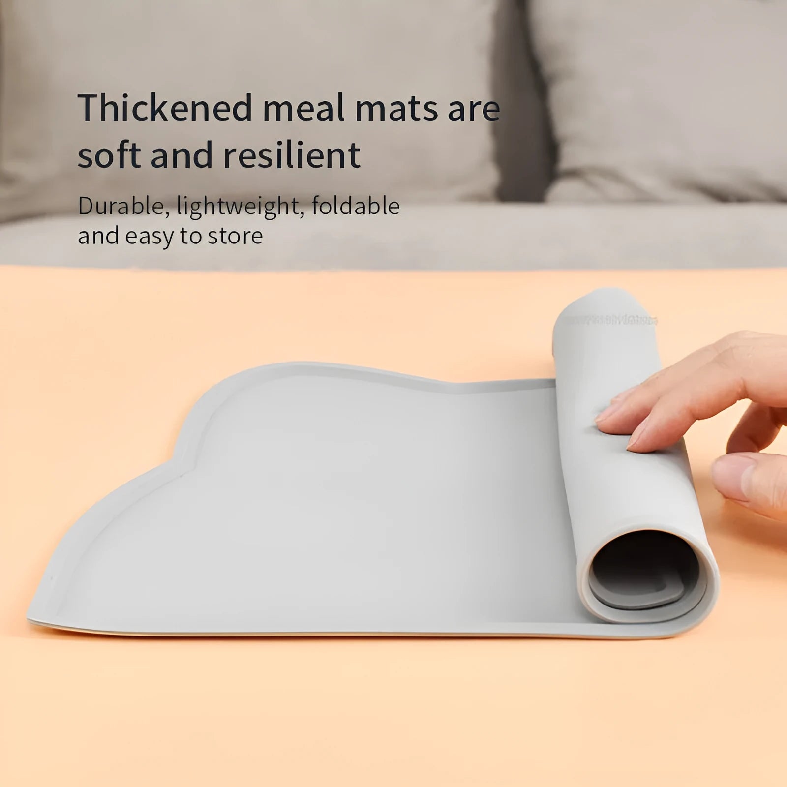 Silicone pet feeding mat in cat head shape measuring 44 by 24 centimetres