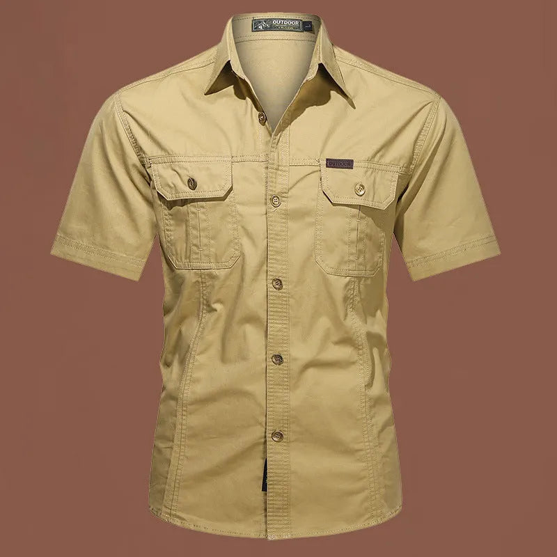Men's loose fit cotton work shirt in army green with short sleeves and button front.