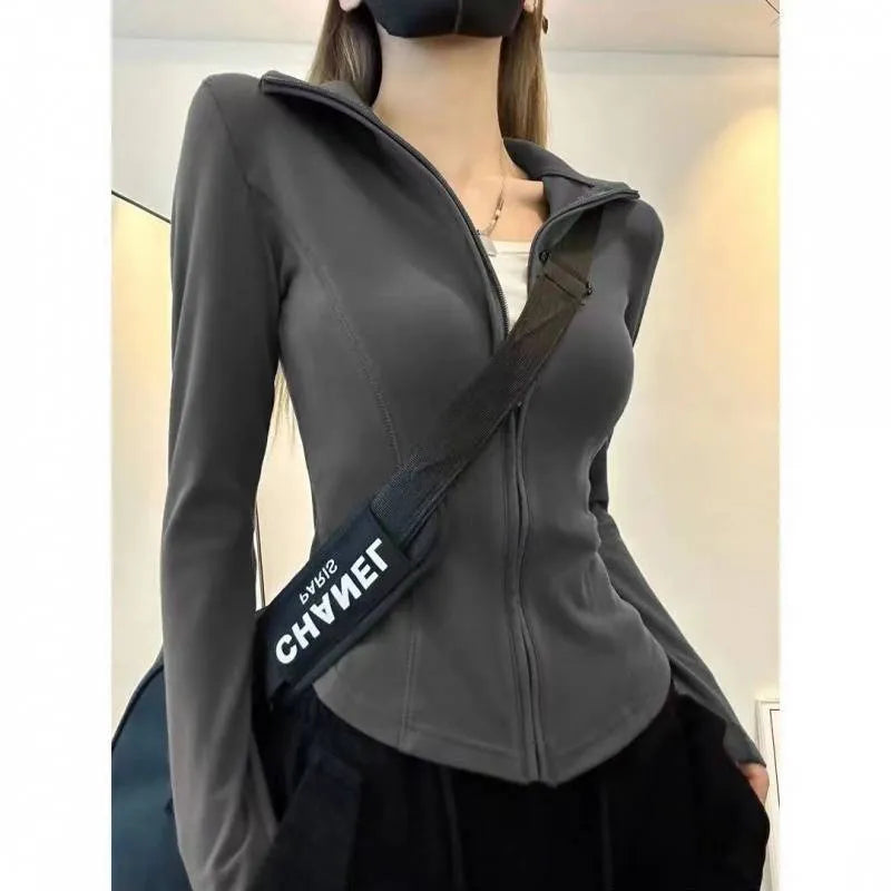 Women's slim fit zip cardigan in Dralon, grey elastic, with flying sleeves and solid colour design.