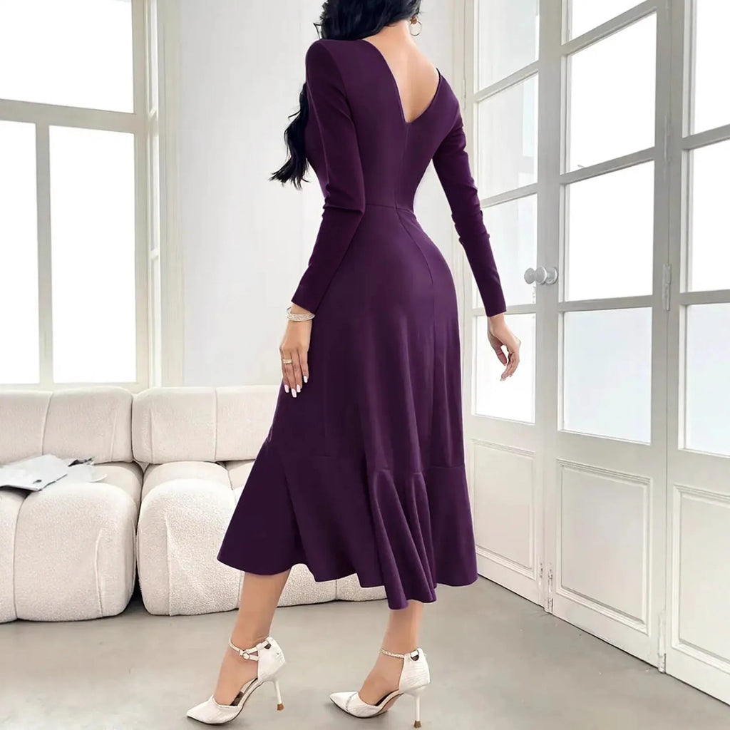 Purple women's long sleeve pullover dress with ruffles at the mid waist.