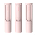 Rotating cylinder electrostatic pet hair removal brush in white, 4.3x4.3x18.3cm, on a fabric surface