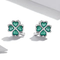 White gold plated textured green dripping lucky stud earrings with four-leaf clover design on 925 silver