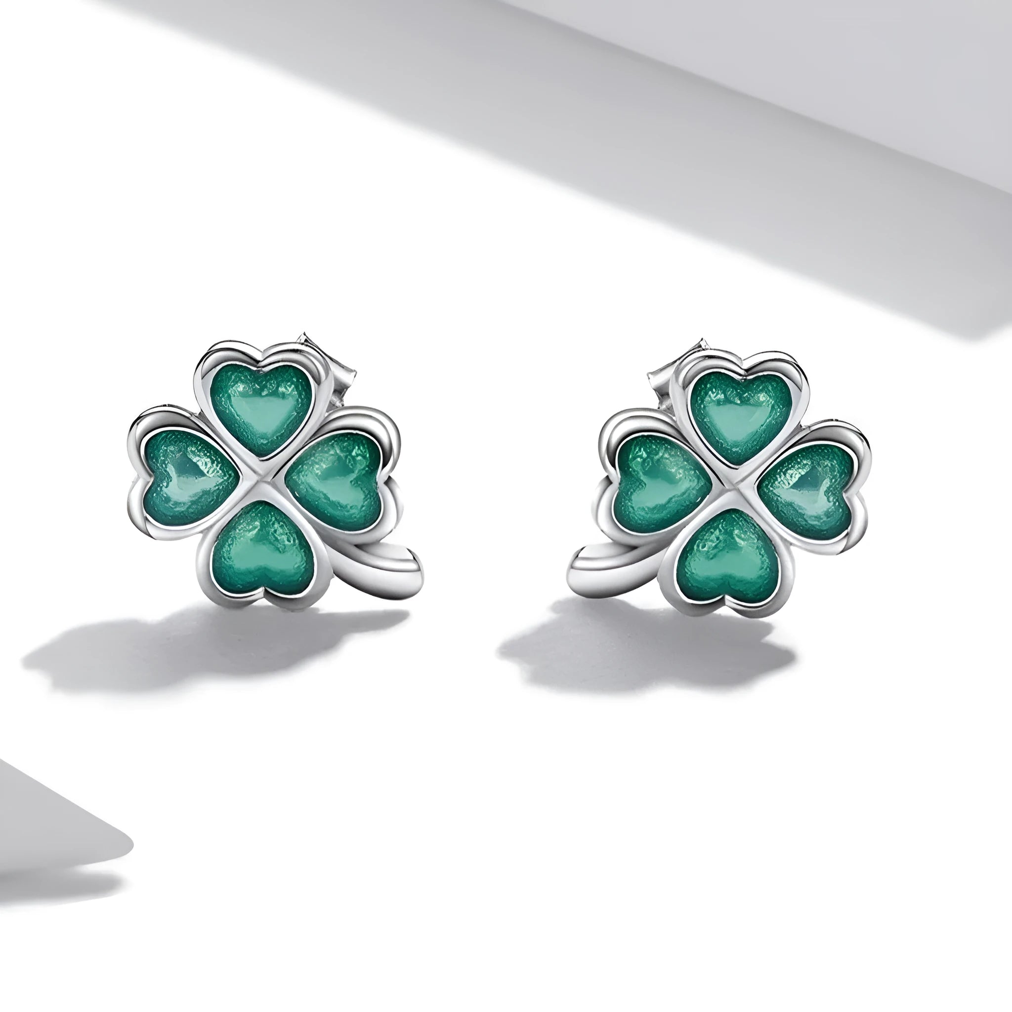 White gold plated textured green dripping lucky stud earrings with four-leaf clover design on 925 silver