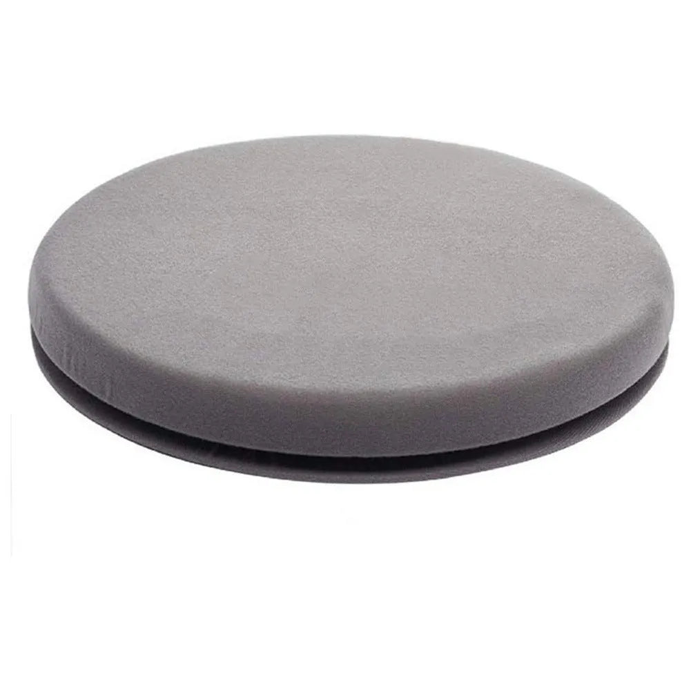 Grey circular car seat cushion with 360-degree rotation feature on a car seat