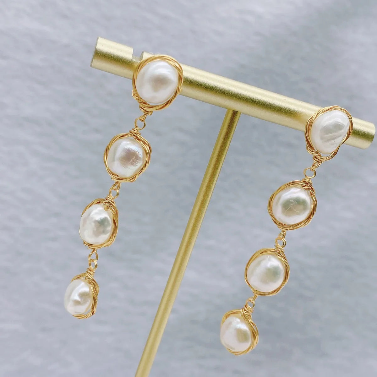 Handmade natural pearl drop earrings with tassel detailing in white colour for women