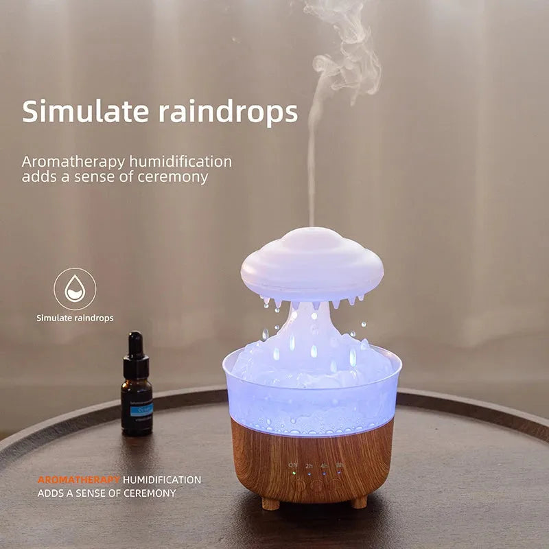 Wood grain white rain cloud shaped humidifier diffuser with coloured LED lights on a table