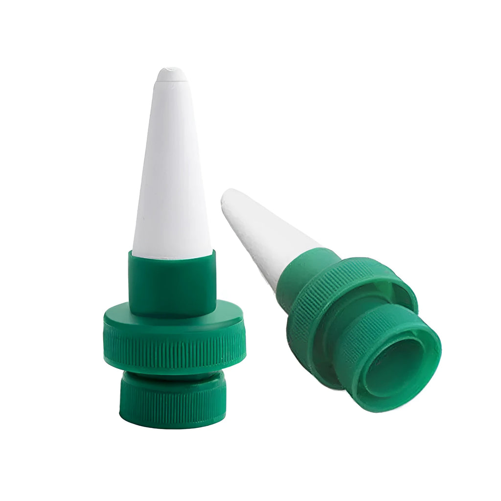 Green ceramic plant water dripper attached to plastic bottle for DIY garden irrigation system
