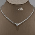 Heart pendant necklace with rhinestone crystal on a 41-50cm box chain, available in gold or silver finish.