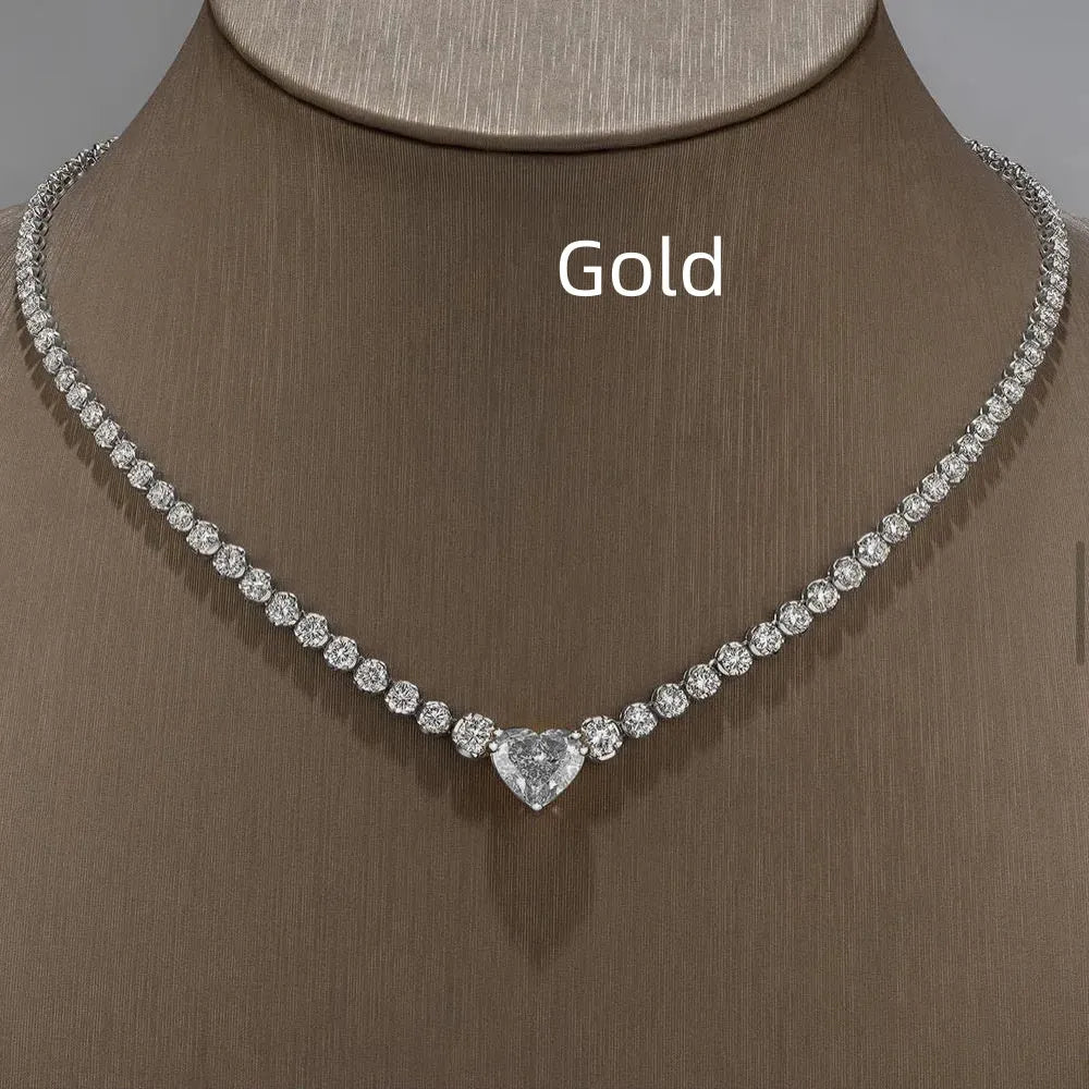 Heart pendant necklace with rhinestone crystal on a 41-50cm box chain, available in gold or silver finish.