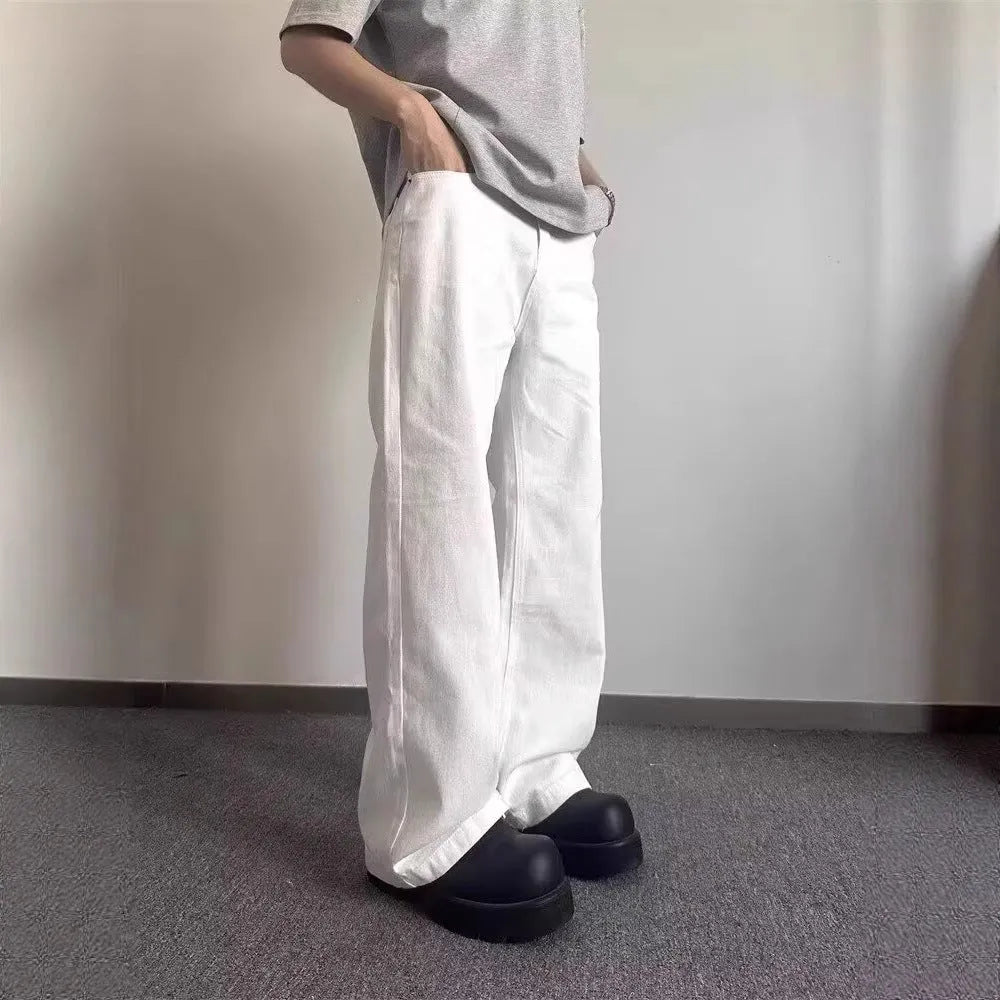 Men's white straight-leg jeans with loose fit and mid-waist cut