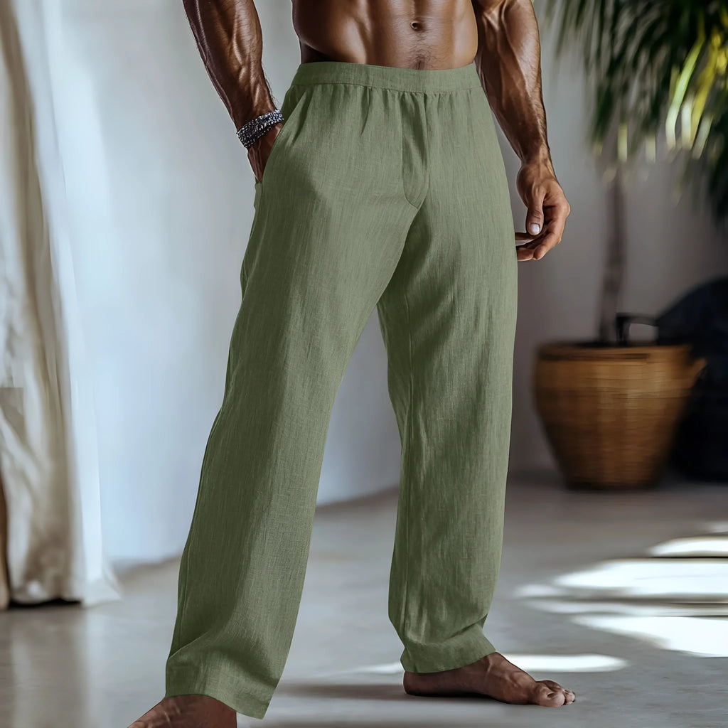 Man wearing straight-leg cotton linen casual trousers in a solid colour with pockets.