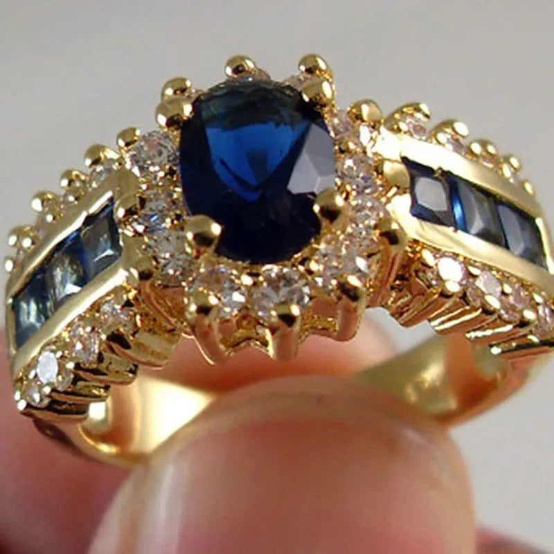 Personalised zinc alloy unisex ring in sunflower blue diamond and square zircon designs on a size chart.