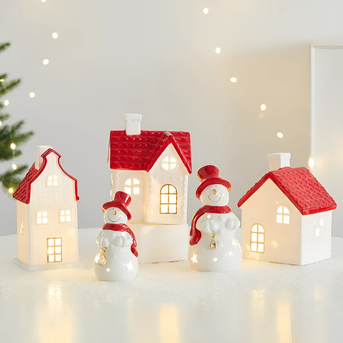 Ceramic Christmas snowman decoration with luminous glow on desktop
