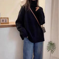 Women's loose fit turtleneck sweater with thick curling pile collar in camel colour