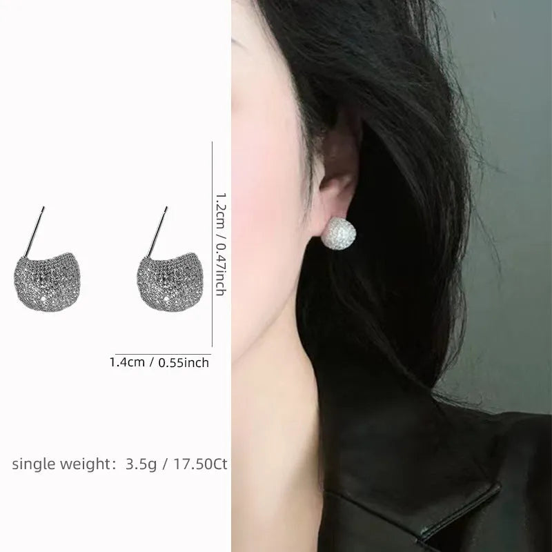 Women's gold and white drop-shaped ear clip earrings with full diamond embellishment and geometric golden beans design