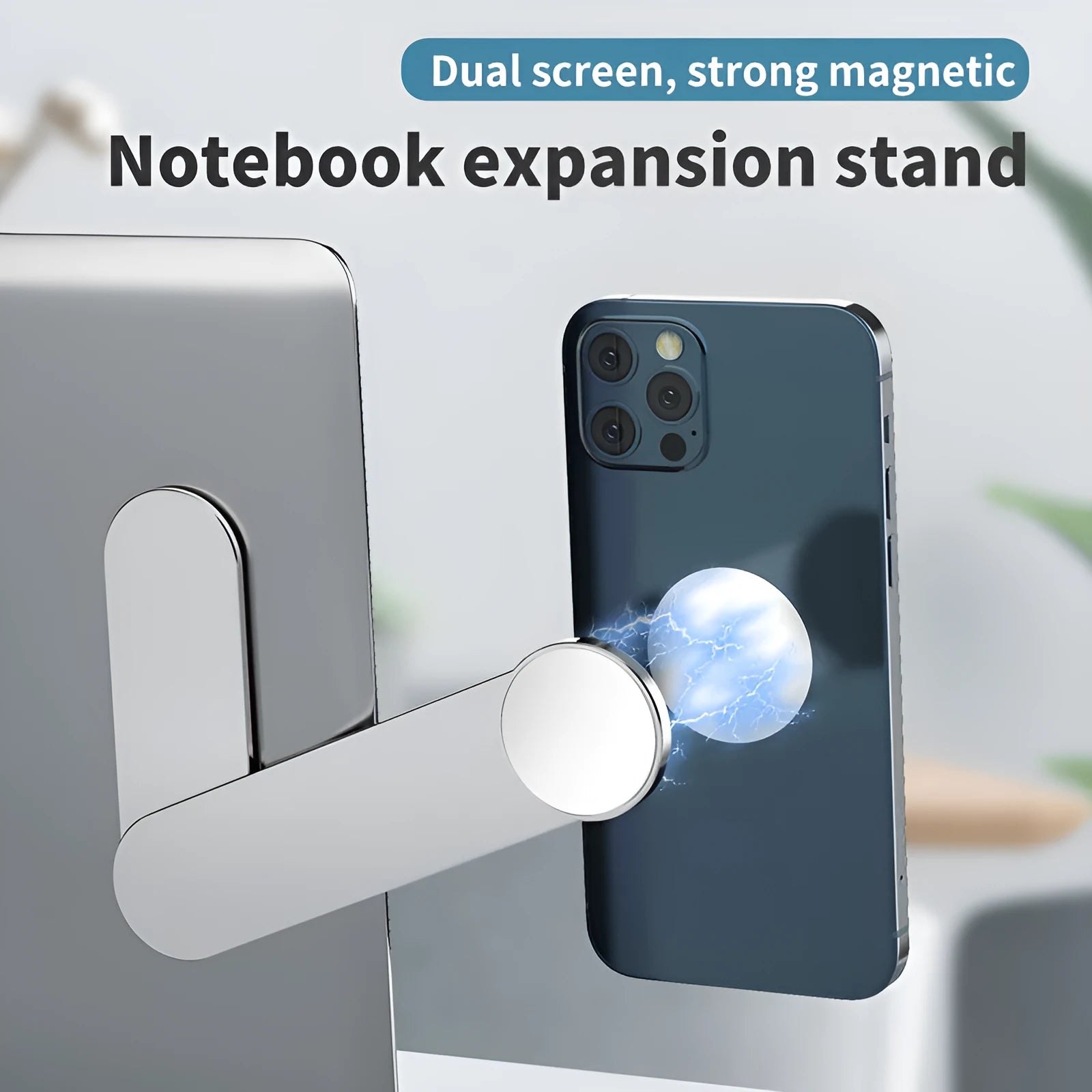 Silver aluminium alloy magnetic mobile phone bracket on desk with laptop for dual screen use