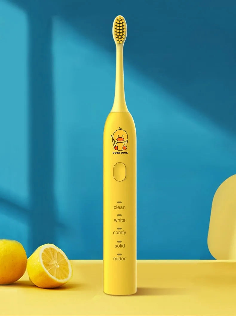 Yellow rechargeable electric toothbrush with small duck design and USB charging cable