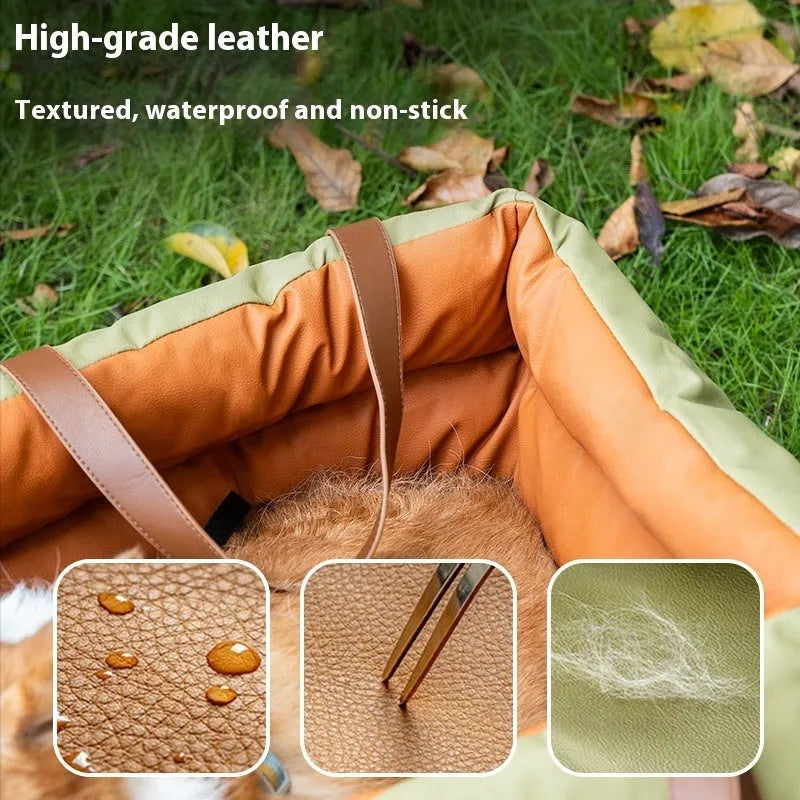 Brown cloth portable cat car kennel with mesh windows, shown on a car seat.