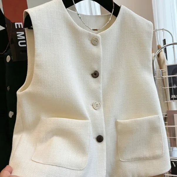 Women's sleeveless round neck vest in black, showing French bandage dress style.