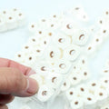 Miniature simulated toilet paper roll model made from paper for dollhouse and children's pretend play.