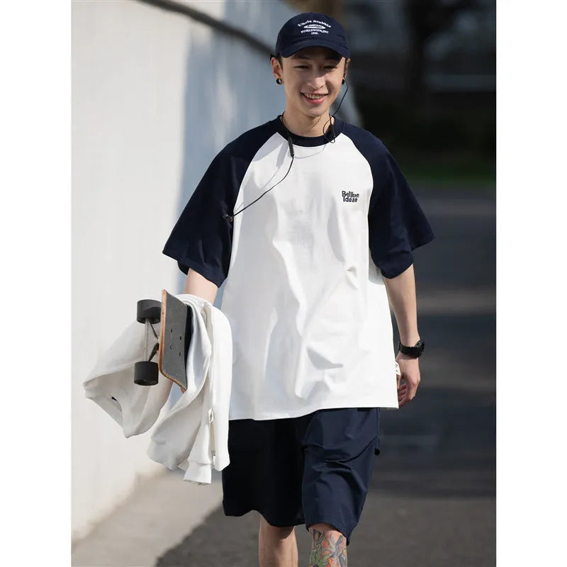 Men's blue casual Japanese-style T-shirt with raglan sleeves on a hanger