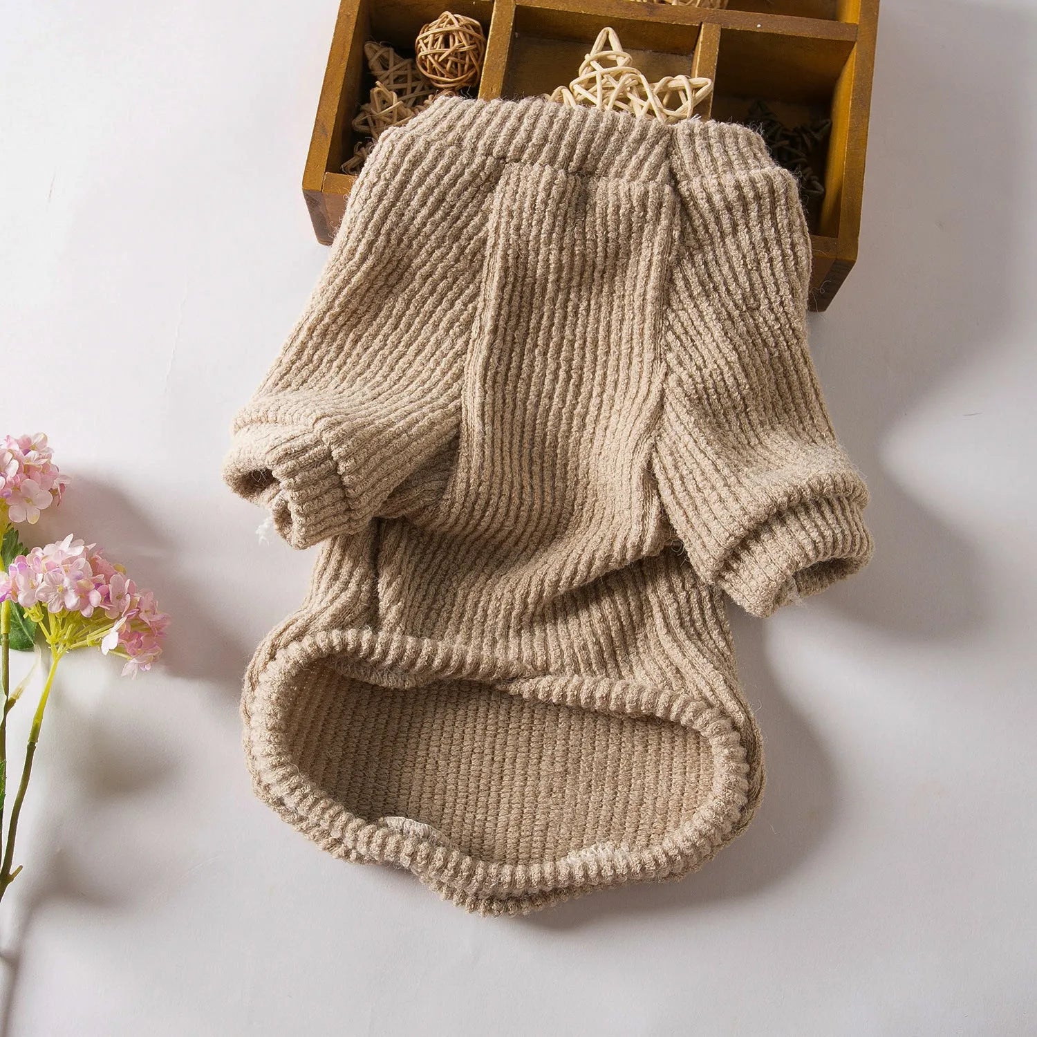 Brown knitted pullover sweater on small dog showing casual design with five size options