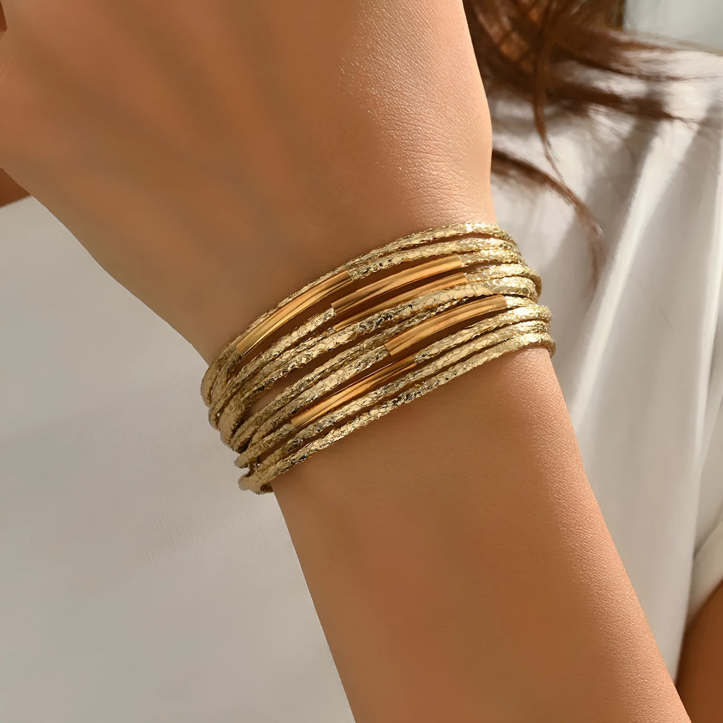 Multi-layer magnetic leather bracelet for women with round alloy element in gold, black, and coffee colours