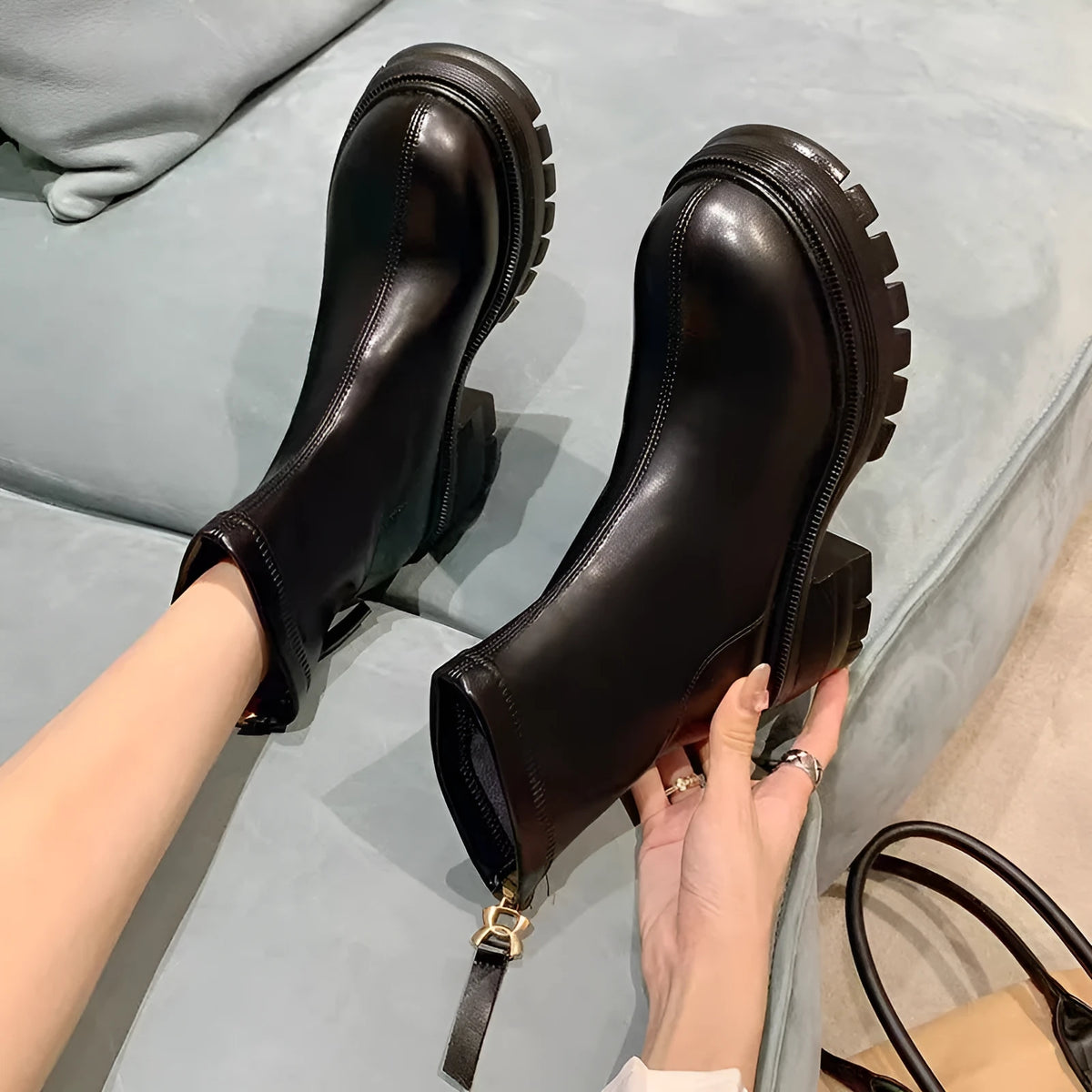 White platform ankle boots for women with thick foam rubber sole, mid-calf shaft, square heel, round toe, and back zipper.