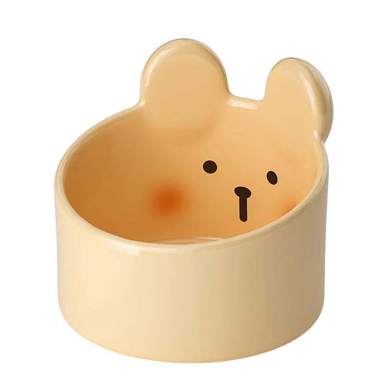 White and yellow ceramic pet feeding bowls with animal patterns in large and small sizes