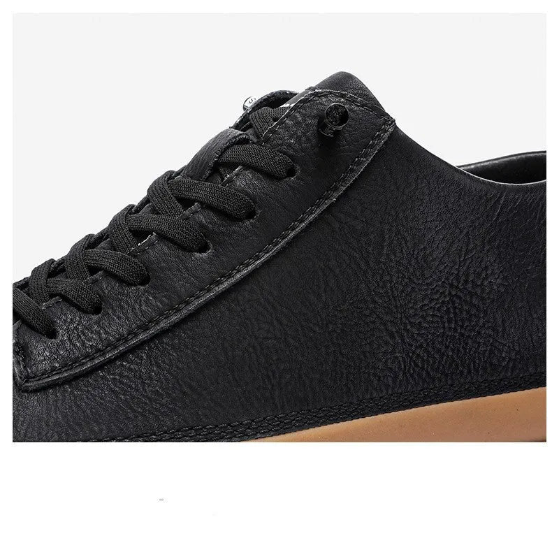 Men's black leather casual shoes with white soles and lace-up front.
