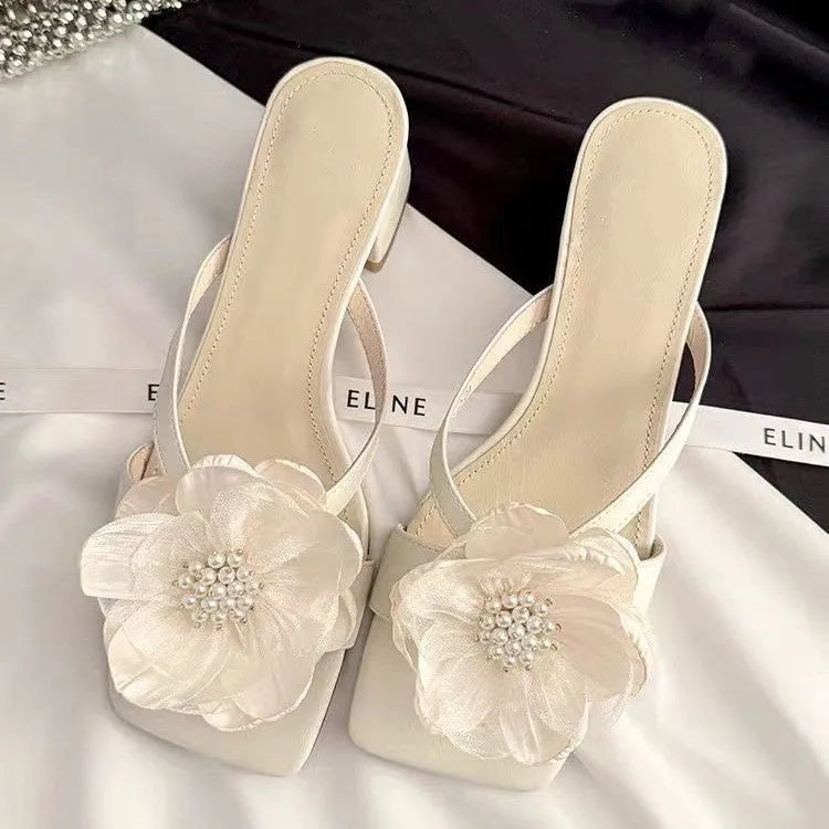 Women's cream chunky heel sandals with a square toe and a single satin strap.