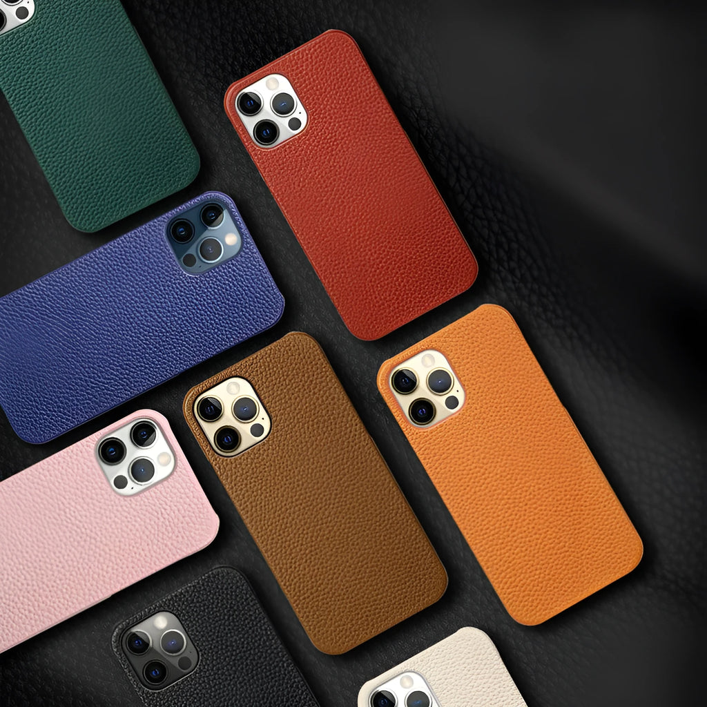 Genuine leather protective case for Apple iPhone in a selection of colours on a table.