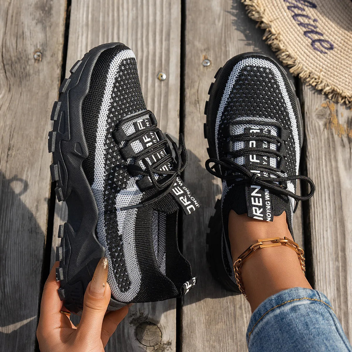 Women's Flyknit mesh lace-up sneakers in low flat heel design for walking and running