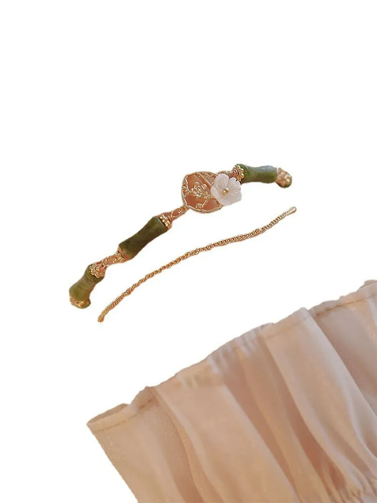 Natural olivine double layer bracelet with braided cord and Bells of Ireland design