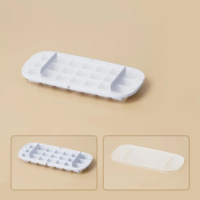 Food-grade plastic ice cube tray with grid, ice shovel, and storage compartment in blue colour.