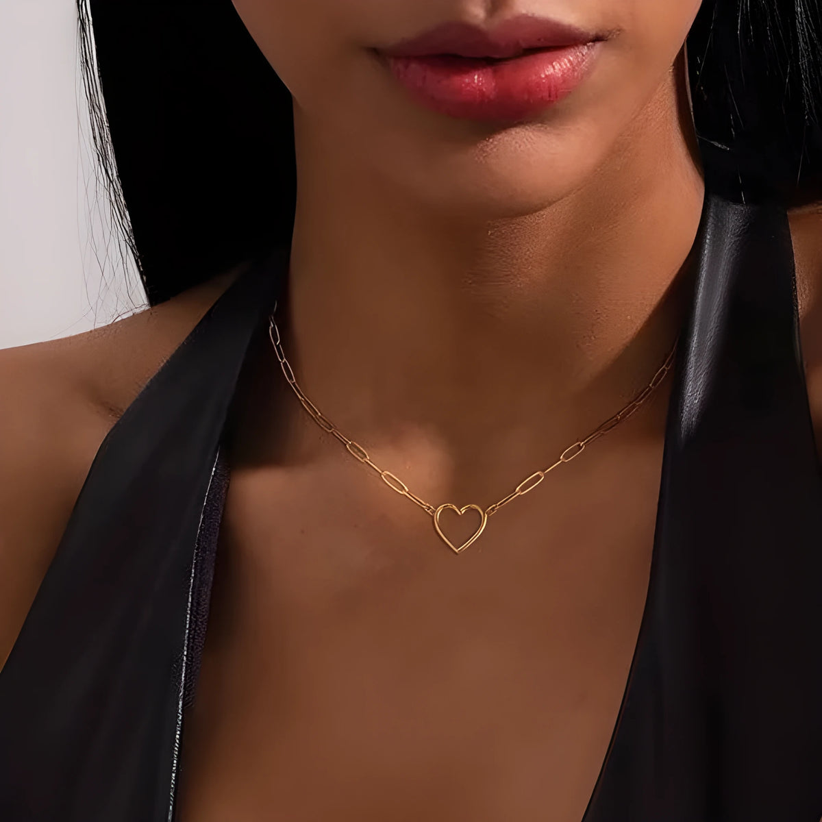 Titanium steel paperclip twist necklace in gold with electroplated finish, shown on a white background