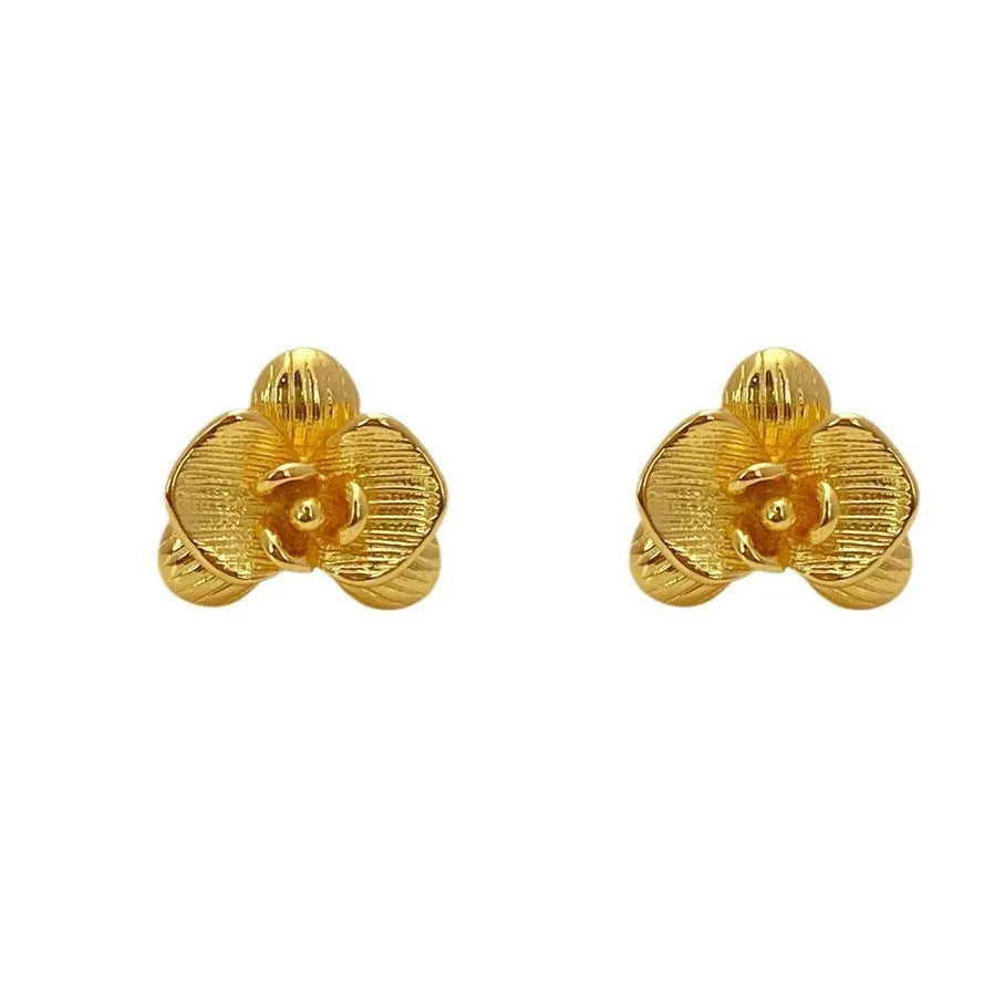 Retro flower earrings with gold or silver electroplated finishes and detailed petal design elements