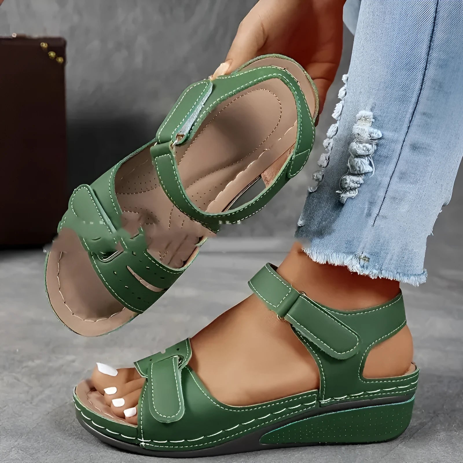 Women's beige strap sandals with a thick composite sole and adjustable Velcro fastening.
