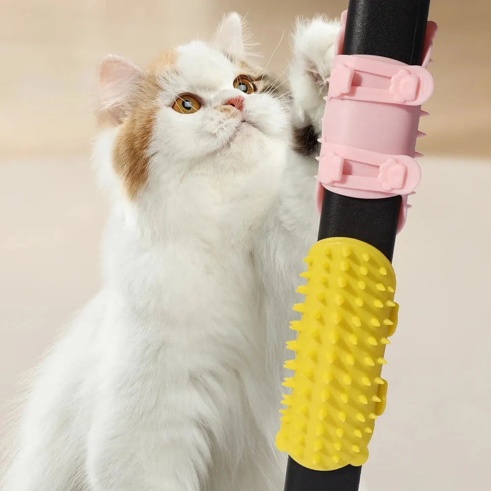 Silicone cat grooming massage comb with adjustable strap mounted on furniture leg