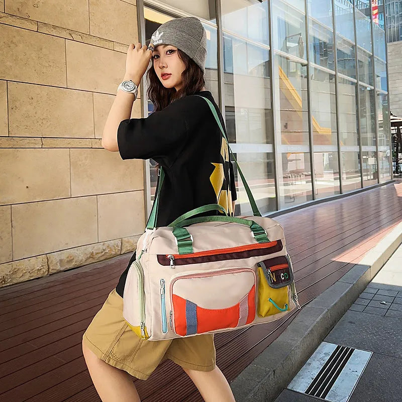 Large black oxford cloth sports messenger shoulder bag showing its spacious main compartment.