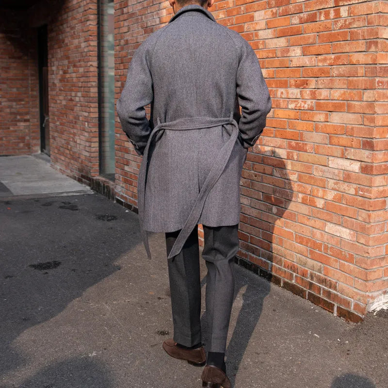 Men's herringbone wool slim fit mid length coat in blue with lapel collar and single-breasted placket