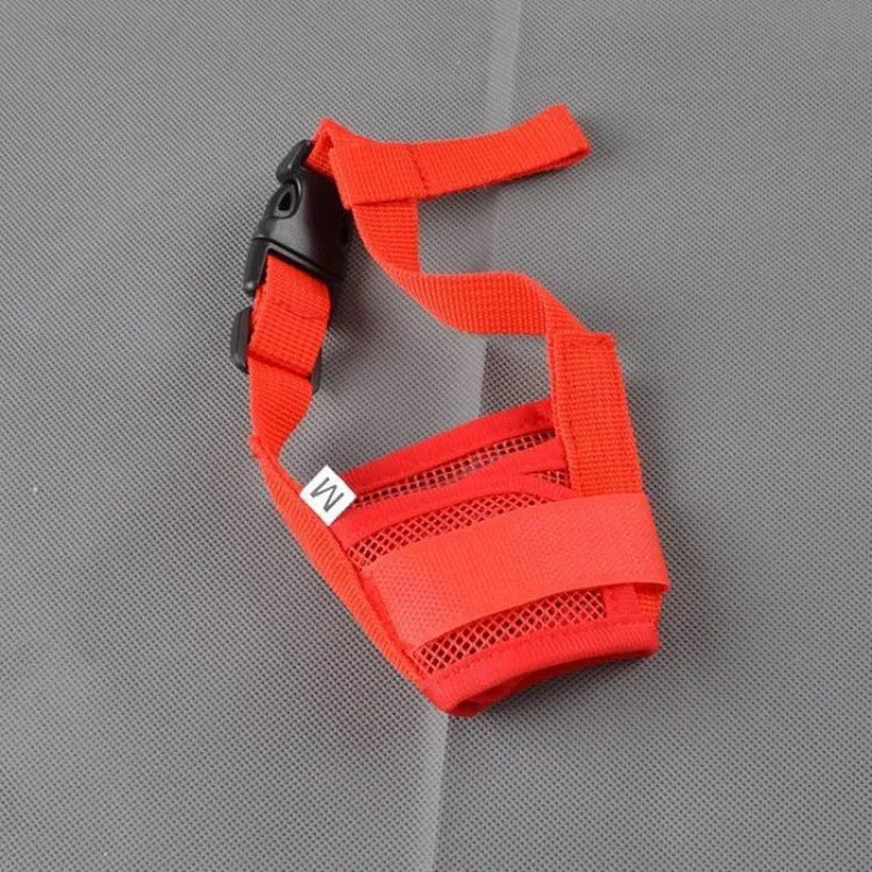 A black plastic basket-style dog muzzle shown on a size chart with measurements for S, M, L, XL, and XXL sizes.