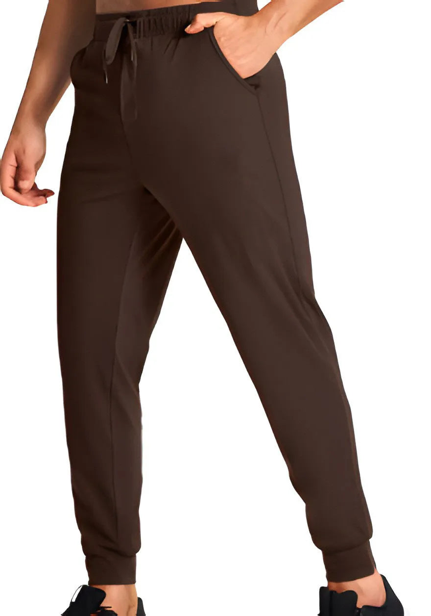 Men's loose fit solid colour casual trousers in polyester fabric on a hanger.