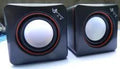 Small black square 2.0 USB computer speaker for Model 700B PC on a desk