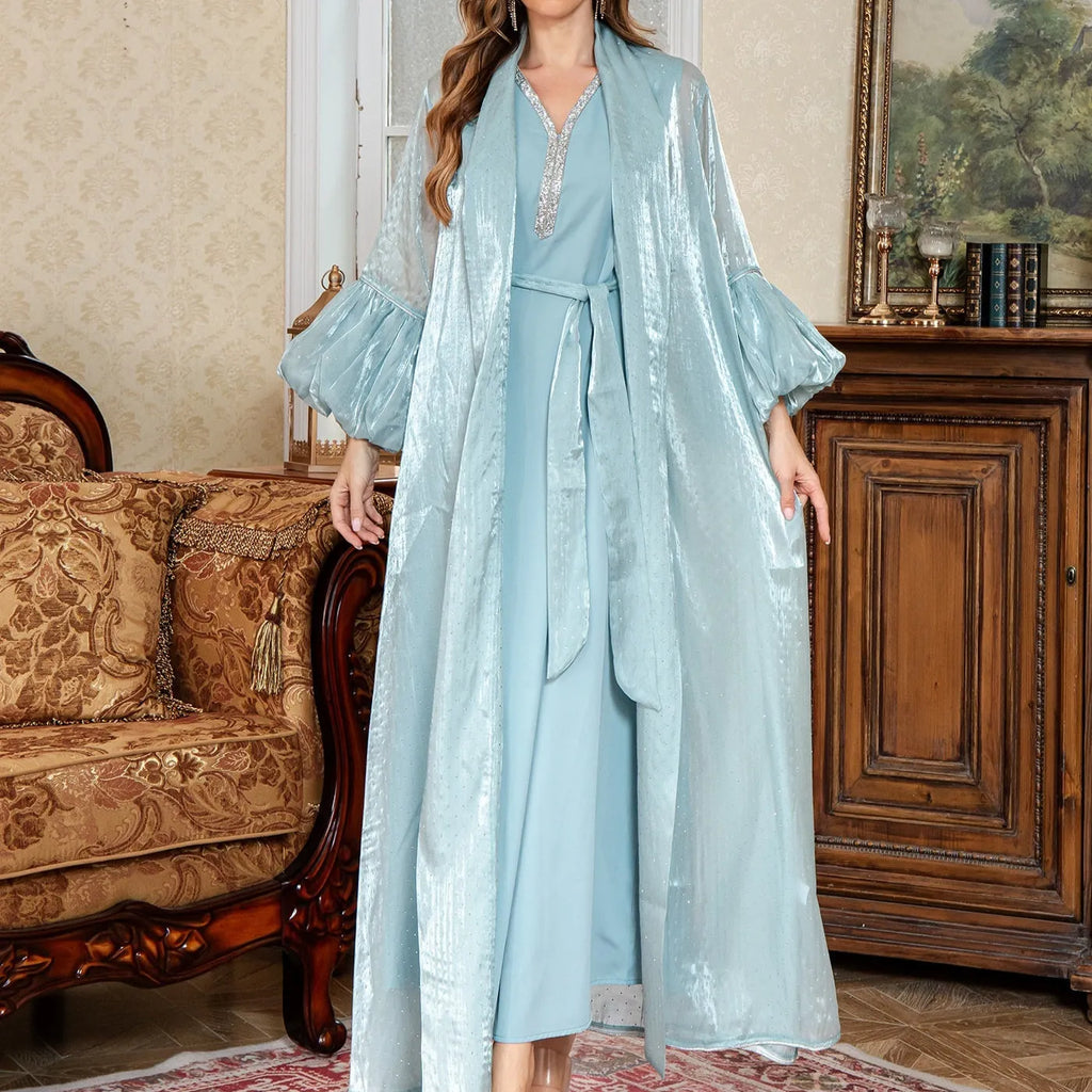 Dubai-inspired two-piece Arabic evening dress in blue with rhinestone detailing and long sleeves