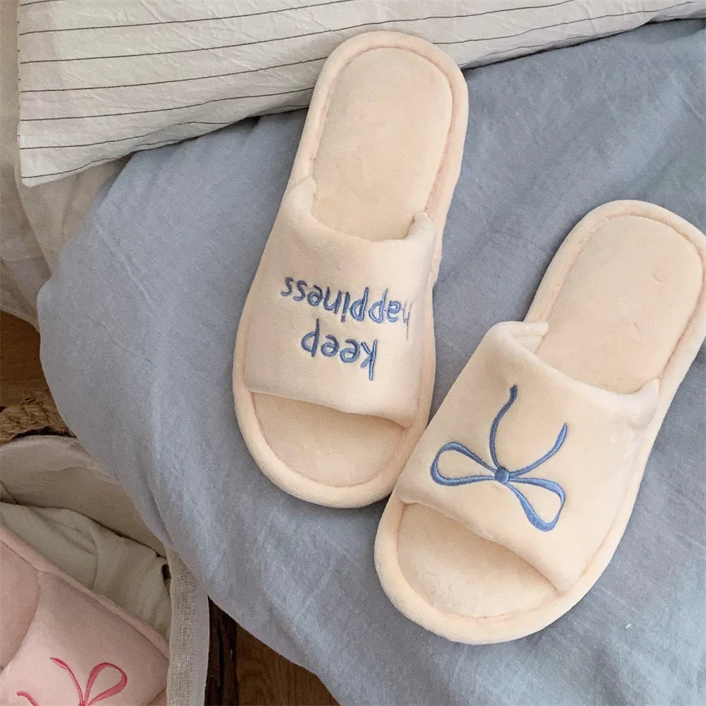 Ladies cotton slippers with letter pattern, bow, suede upper and flat non-slip PVC sole in beige yellow, pink or black